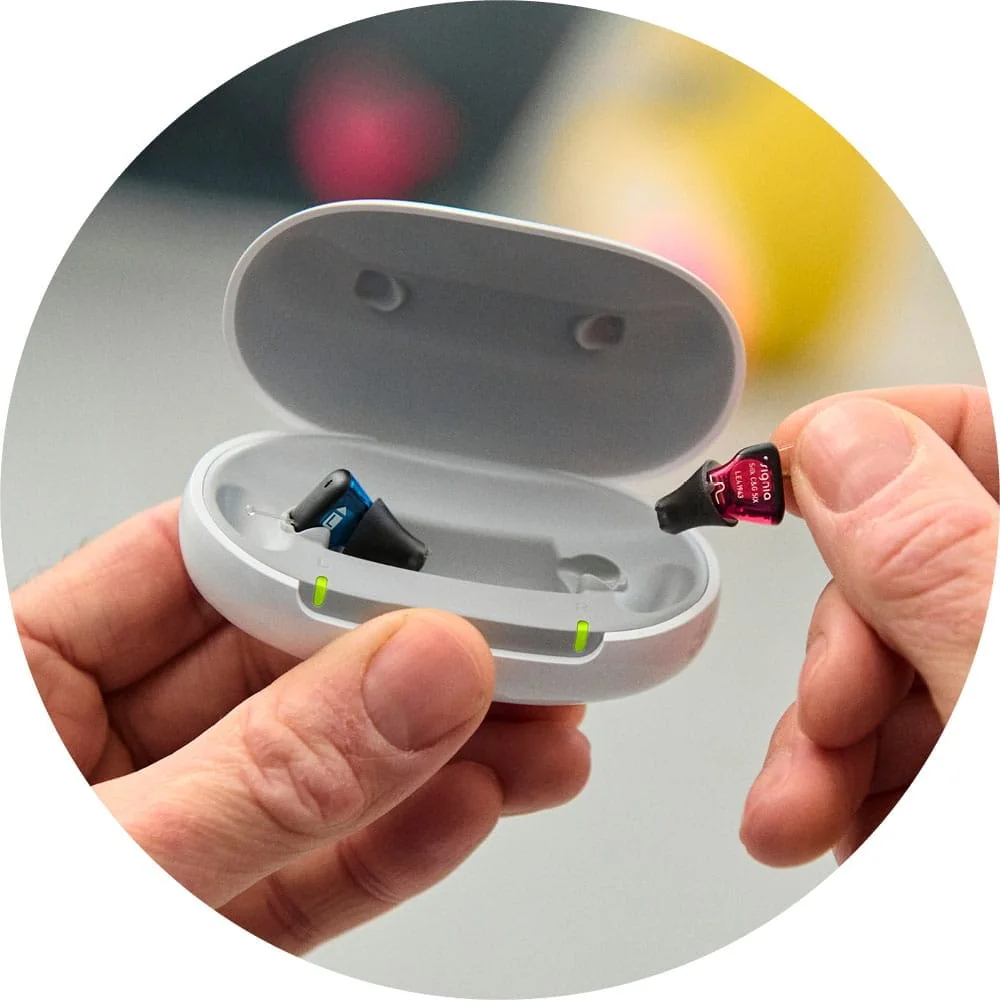 In-ear hearing devices and charging case